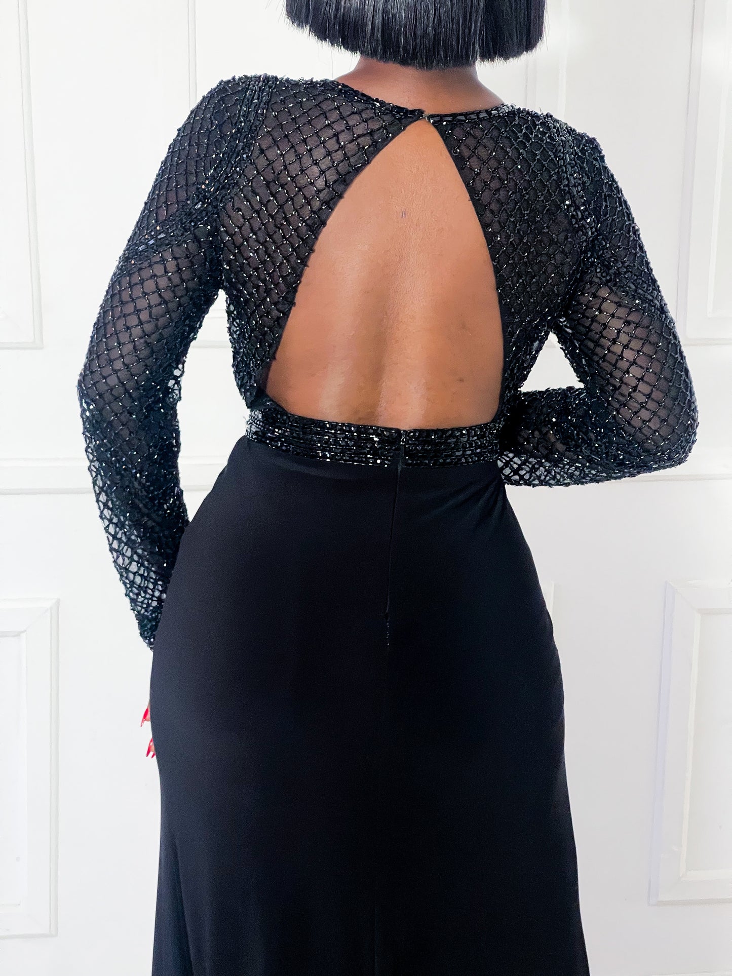 Beaded black gown with open back
