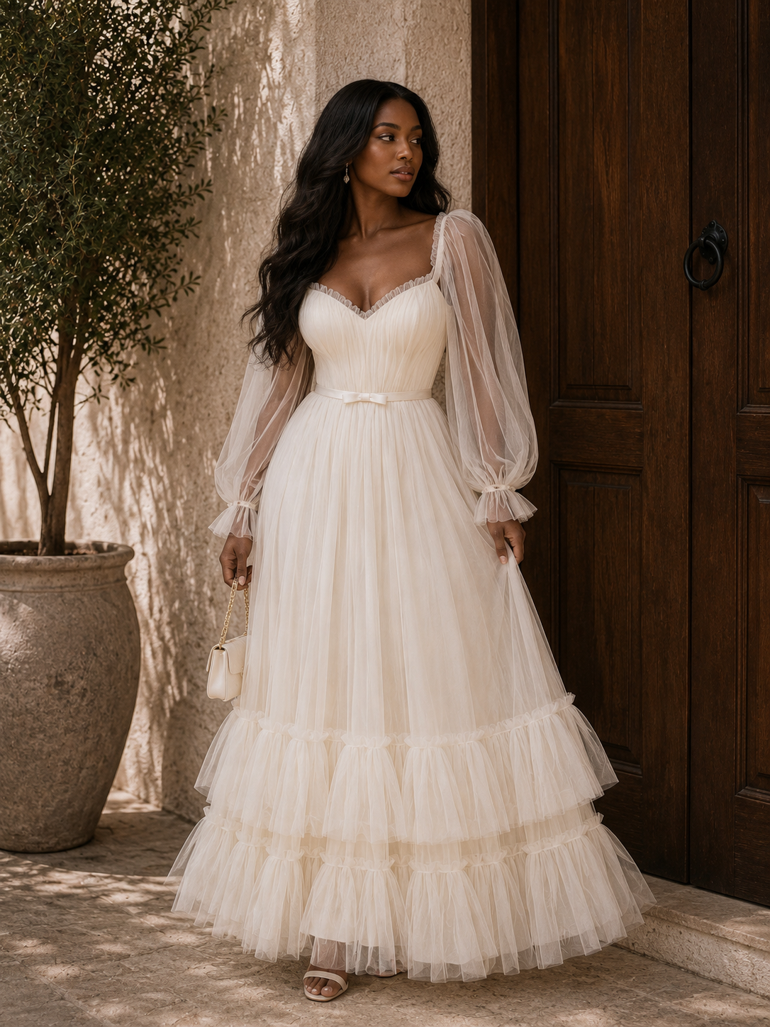 WHITE TULLE LONG SLEEVE GOWN WITH GATHERED HEM