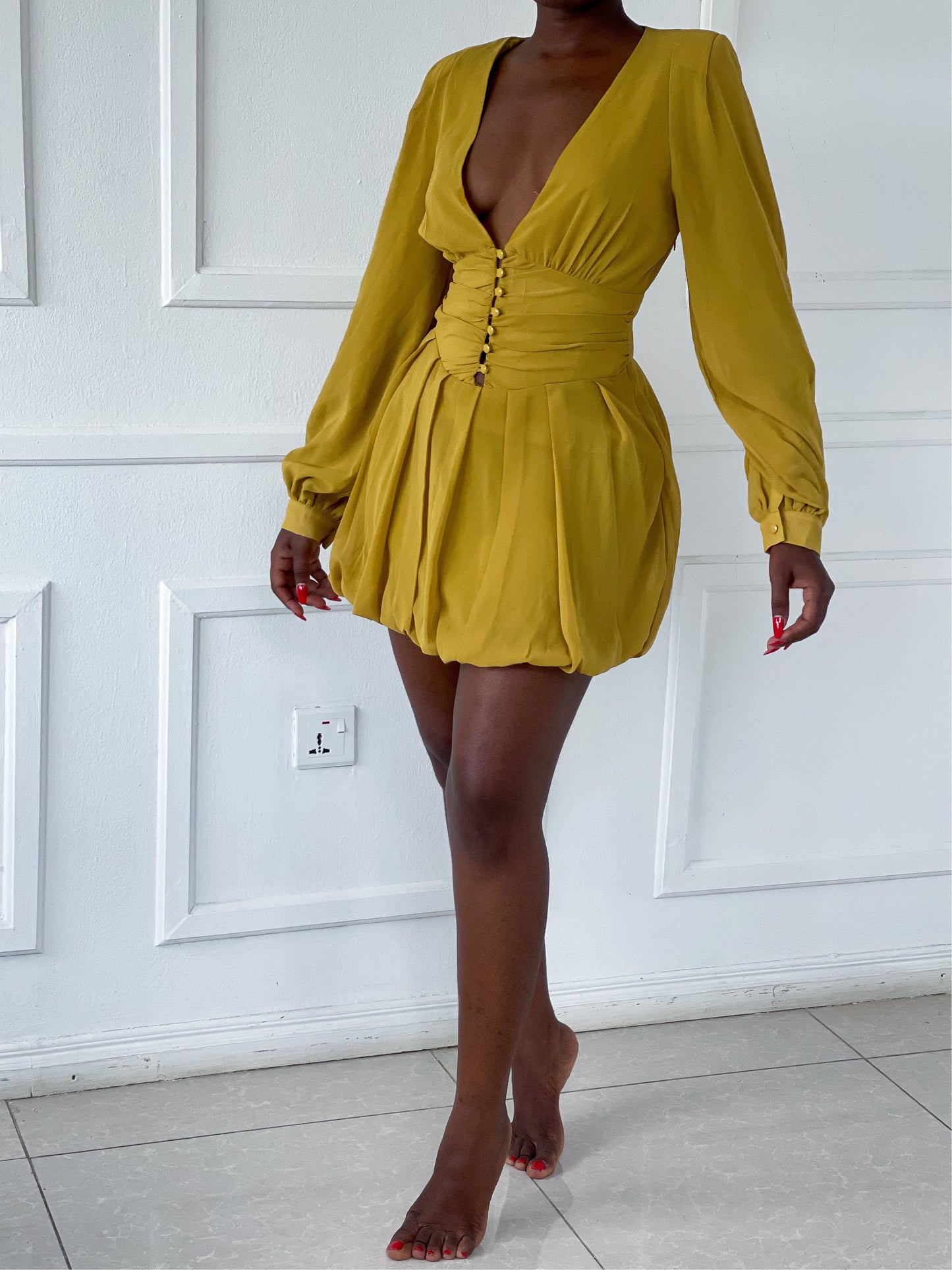 Mini pleated dress with shoulder pads
