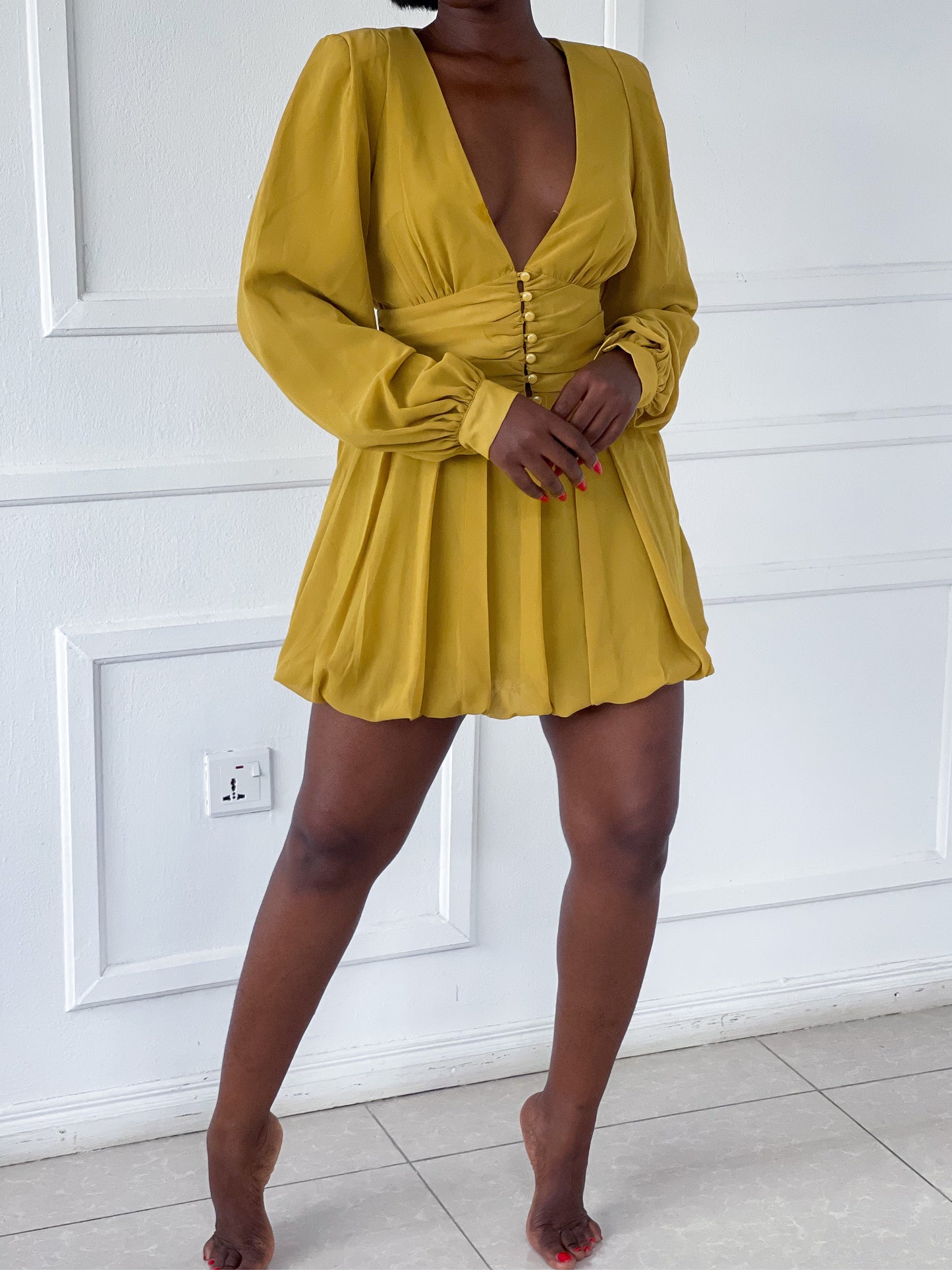 Mini pleated dress with shoulder pads