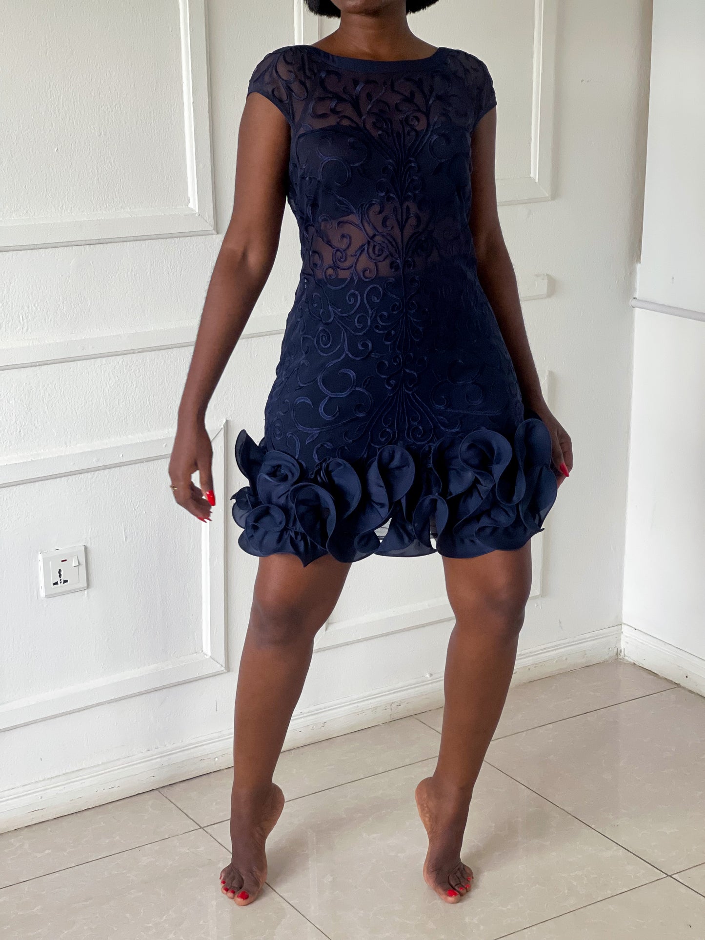 Sheer mini dress with dramatic frill hem