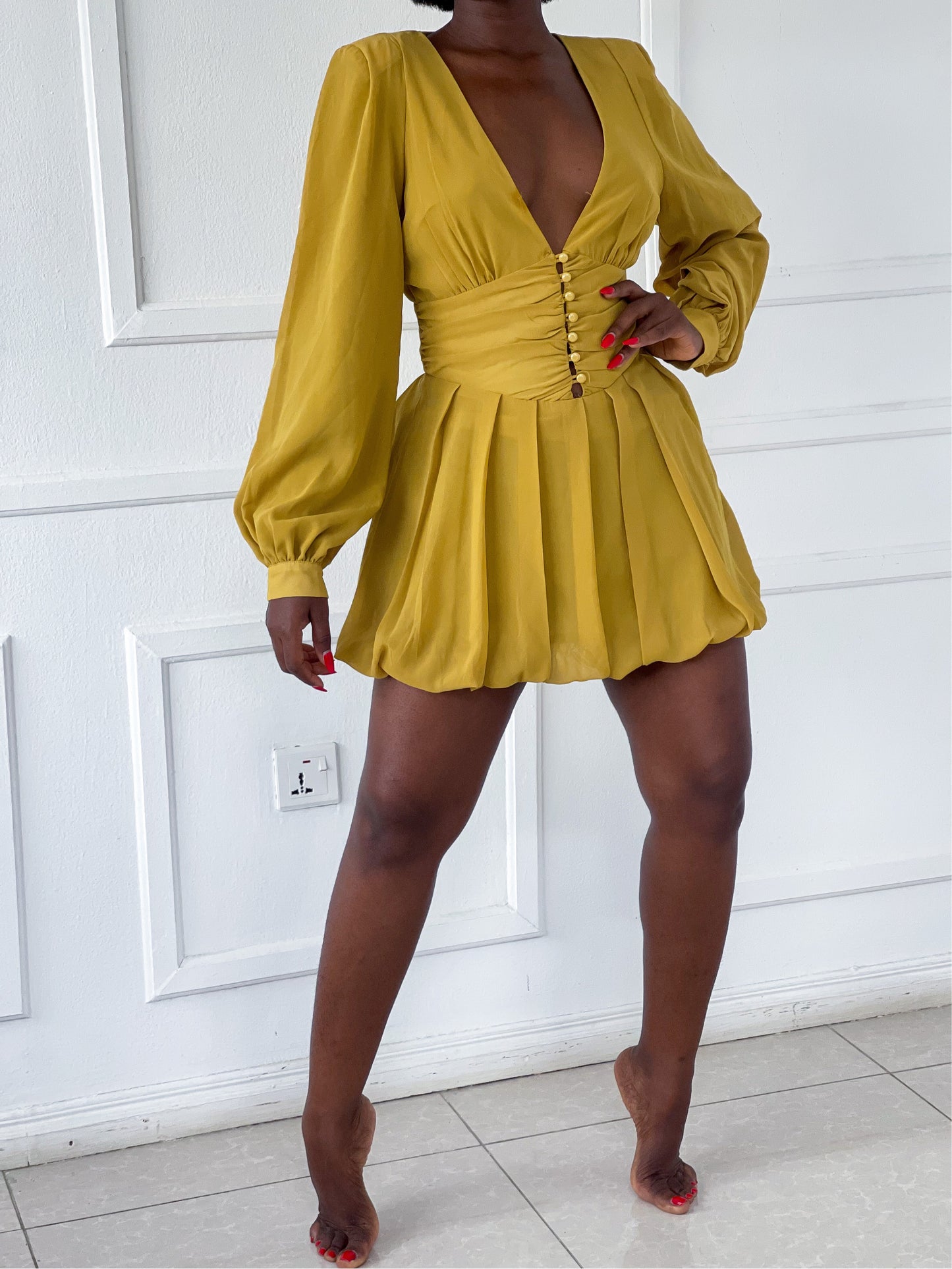 Mini pleated dress with shoulder pads